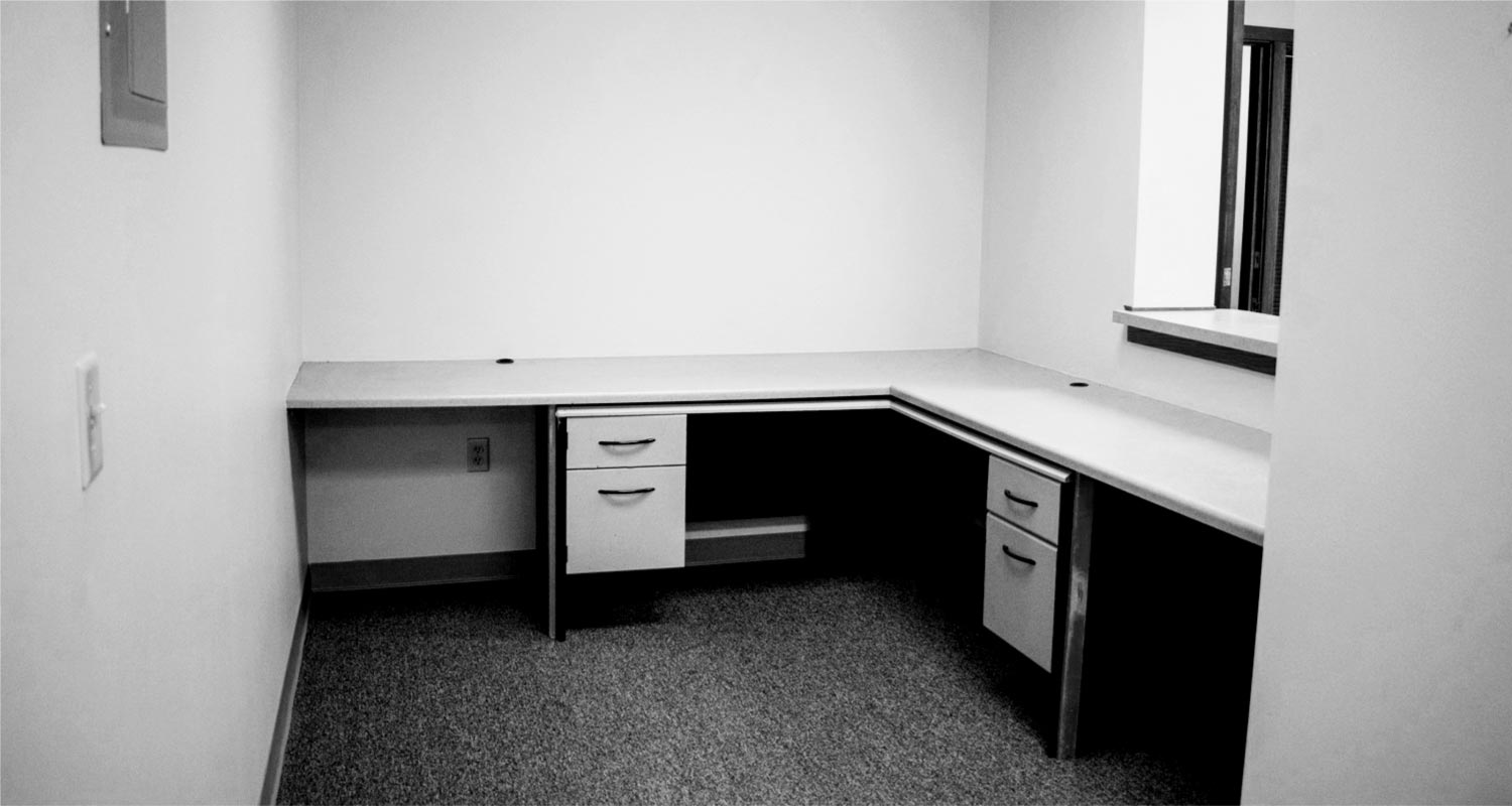 Reception area with desk and filing cabinets