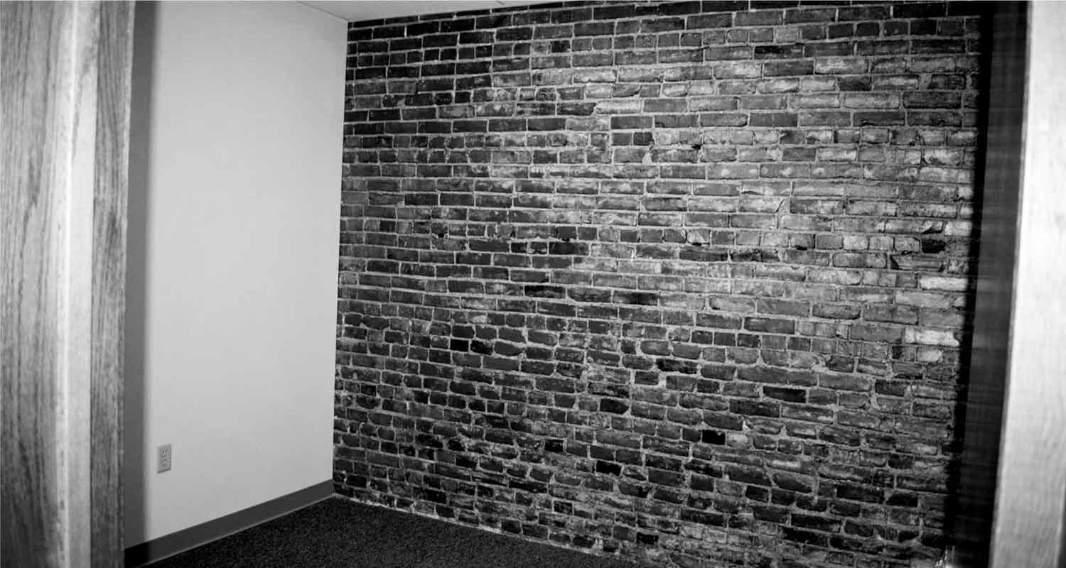 Inner office room with exposed brick